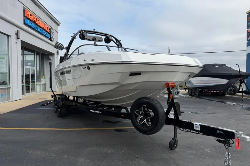 Slide: The Image of 2026 Moomba Tykon boat on trailer at Performance Marine dealership. - 10