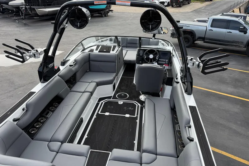 Slide: The Image of 2026 Moomba Tykon boat interior with sleek seating and modern dashboard design. - 12
