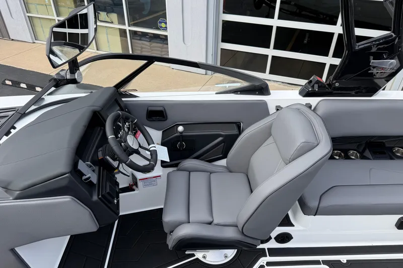 Slide: The Image of 2026 Moomba Tykon boat interior with sleek steering and comfortable seating. - 14