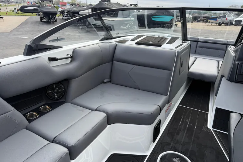 Slide: The Image of 2026 Moomba Tykon boat interior with sleek gray seating and modern design. - 16