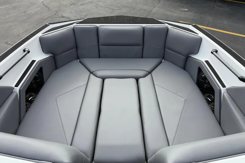 Slide: The Image of 2026 Moomba Tykon boat interior with sleek gray seating and modern design. - 21