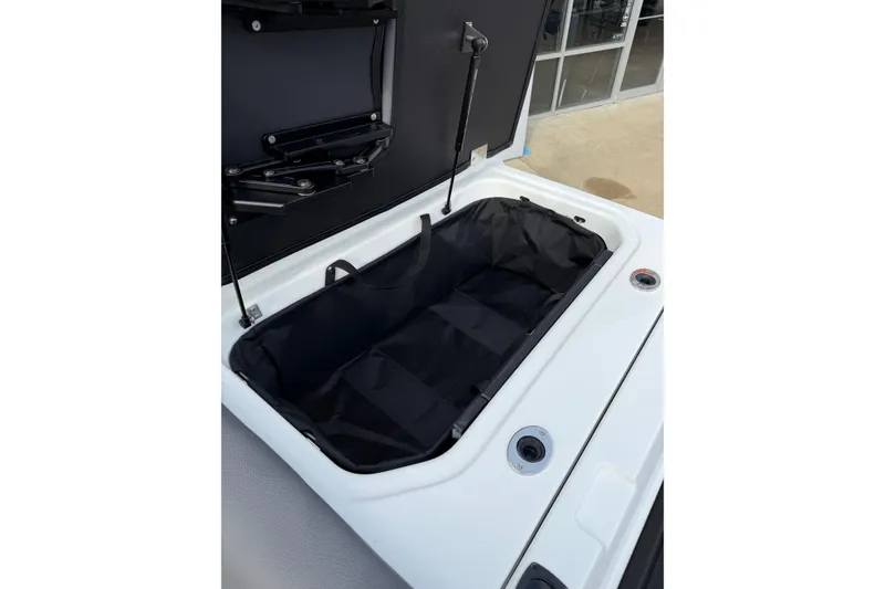 Slide: The Image of Open storage compartment in 2026 Moomba Tykon boat, showcasing interior design and functionality. - 23