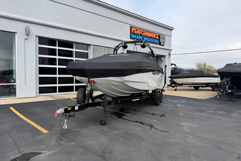 Slide: The Image of 2026 Moomba Tykon boat on trailer at Performance Marine dealership. - 25