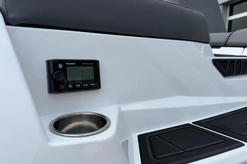 Slide: The Image of 2026 Moomba Tykon boat interior with Fusion MS-NRX300 stereo and cup holder. - 7