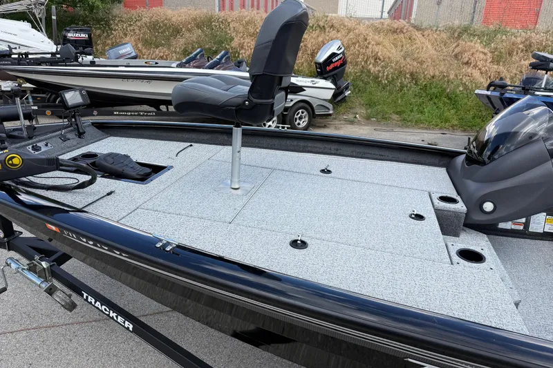 Slide: The Image of 2020 Tracker Pro Team 190 TX fishing boat with seating and equipment on deck. - 17