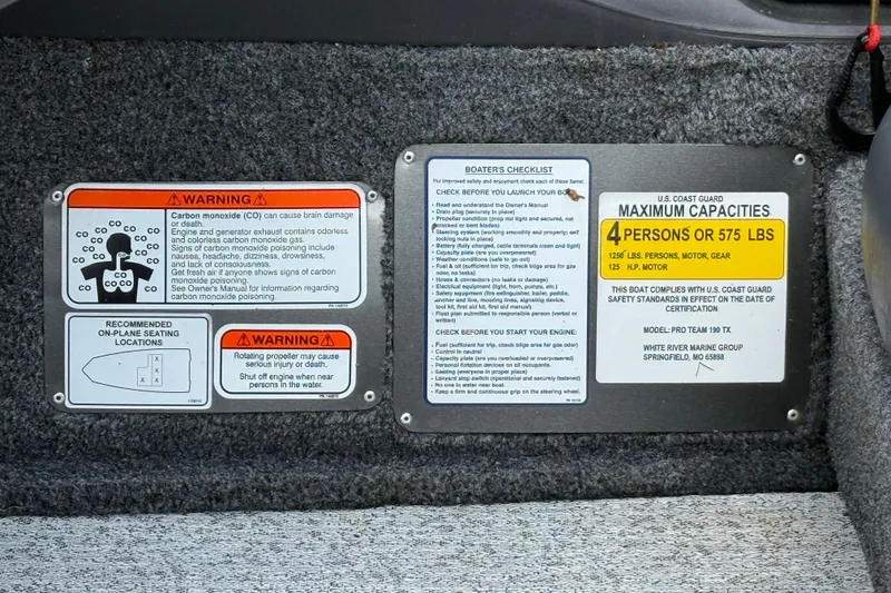 Slide: The Image of 2020 Tracker Pro Team 190 TX safety warnings and capacity guidelines displayed on boat interior. - 19