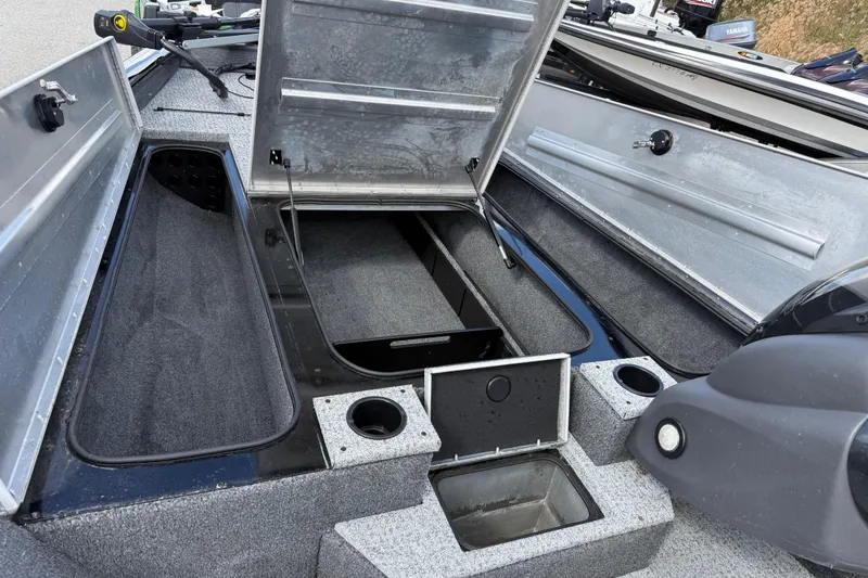 Slide: The Image of 2020 Tracker Pro Team 190 TX boat interior with open storage compartments. - 23