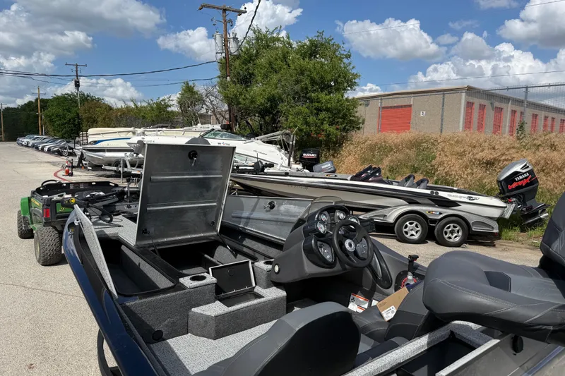 Slide: The Image of 2020 Tracker Pro Team 190 TX boat in a dealership lot under a blue sky. - 26
