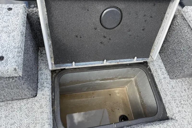 Slide: The Image of Open storage compartment in 2020 Tracker Pro Team 190 TX boat. - 30
