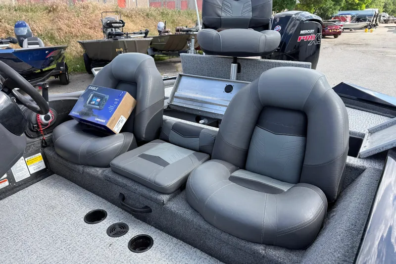 Slide: The Image of 2020 Tracker Pro Team 190 TX boat interior with gray seats and a Lowrance Eagle device. - 33