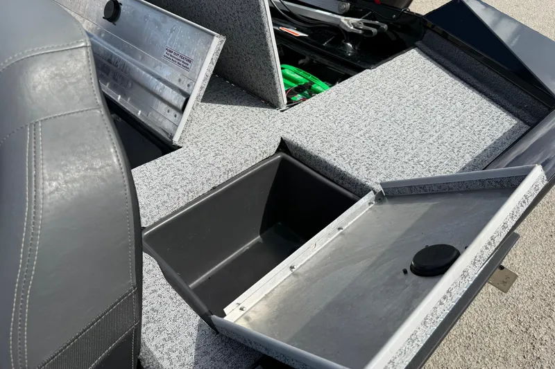 Slide: The Image of 2020 Tracker Pro Team 190 TX boat interior with storage compartments open. - 34