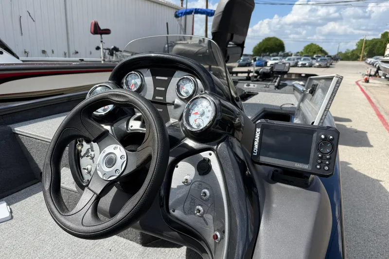 Slide: The Image of 2020 Tracker Pro Team 190 TX boat dashboard with steering wheel and Lowrance fish finder. - 37