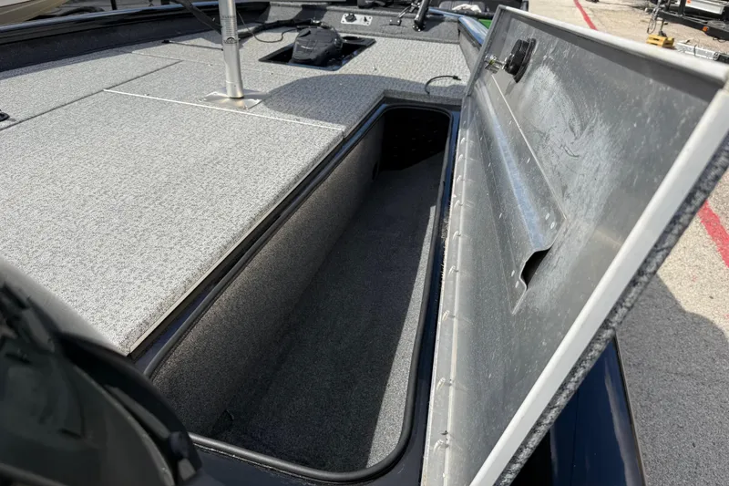 Slide: The Image of Open storage compartment on a 2020 Tracker Pro Team 190 TX boat. - 39