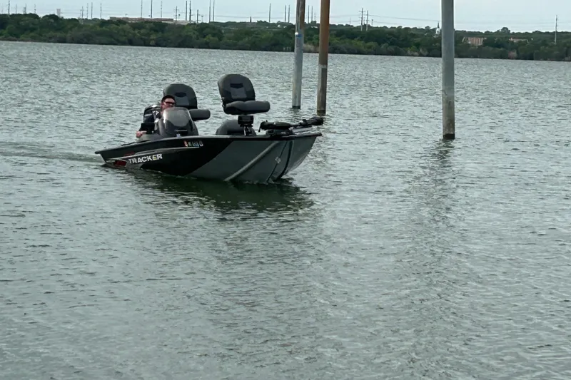 Slide: The Image of 2020 Tracker Pro Team 190 TX boat on a calm lake. - 44