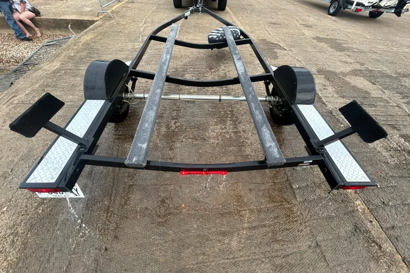 Slide: The Image of Trailer for 2020 Tracker Pro Team 190 TX boat on a concrete ramp. - 45