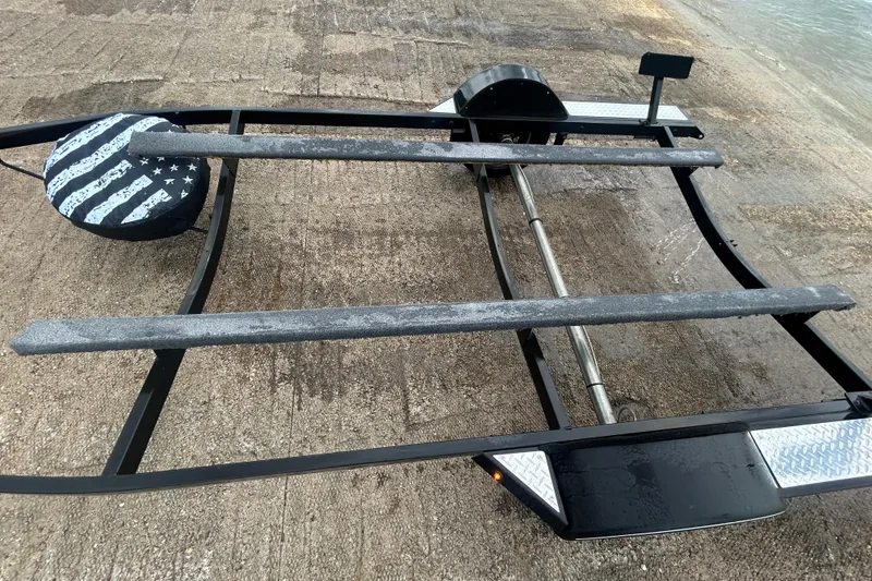 Slide: The Image of Boat trailer for 2020 Tracker Pro Team 190 TX on concrete surface. - 46