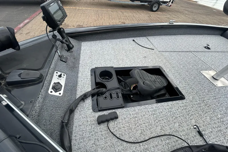 Slide: The Image of 2020 Tracker Pro Team 190 TX boat deck with storage compartment and fish finder. - 49