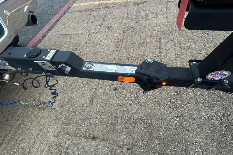 Slide: The Image of Trailer hitch of a 2020 Tracker Pro Team 190 TX on a concrete surface. - 50