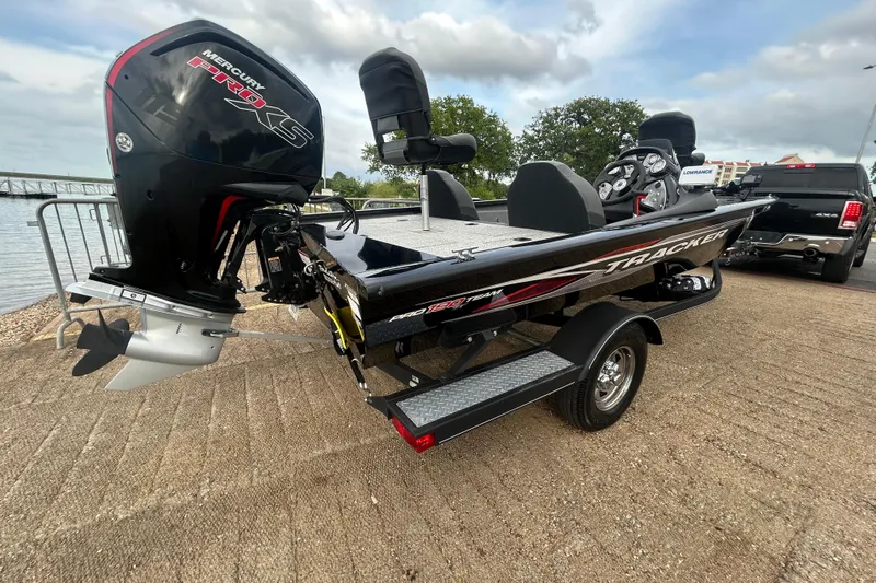 Slide: The Image of 2020 Tracker Pro Team 190 TX boat with Mercury Pro XS engine by a lakeside. - 58