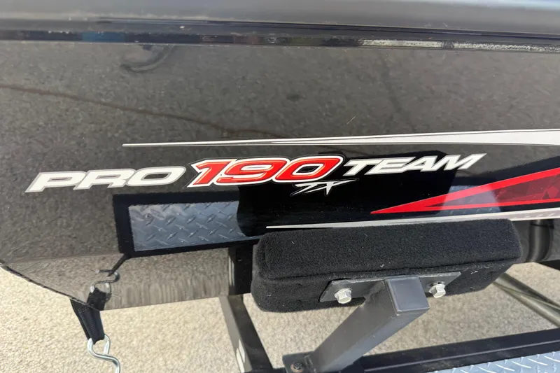 Slide: The Image of 2020 Tracker Pro Team 190 TX boat logo on black surface. - 6