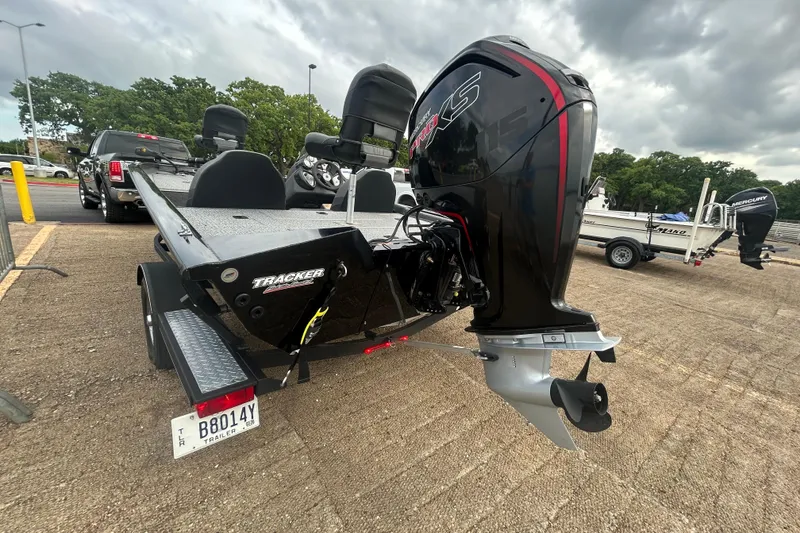 Slide: The Image of 2020 Tracker Pro Team 190 TX boat with powerful outboard motor in parking lot. - 60