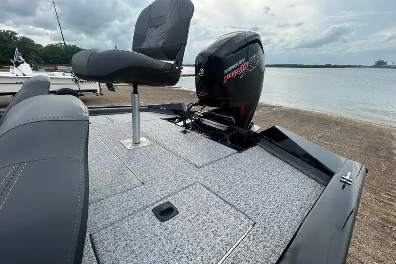 Slide: The Image of 2020 Tracker Pro Team 190 TX boat with Mercury Pro XS engine by the water. - 61