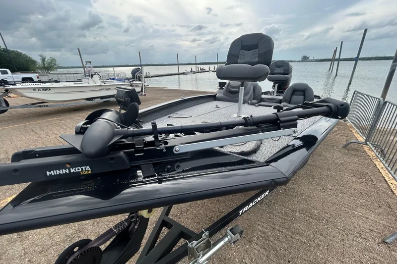 Slide: The Image of 2020 Tracker Pro Team 190 TX fishing boat with Minn Kota Edge trolling motor at a lakeside dock. - 64