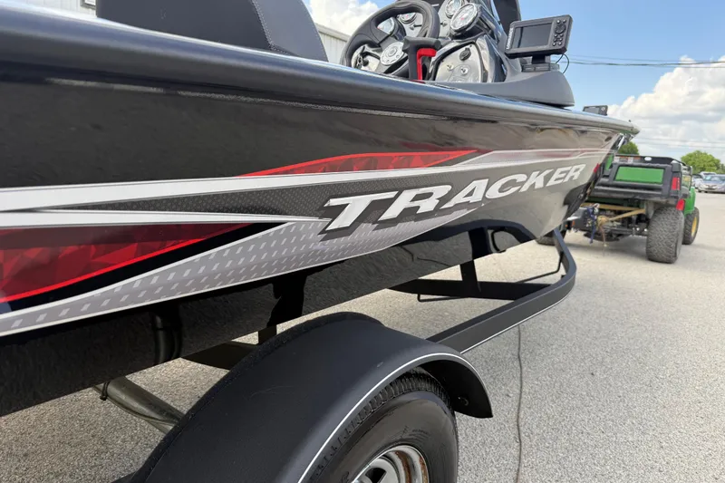 Slide: The Image of 2020 Tracker Pro Team 190 TX boat on trailer, close-up view with logo. - 7
