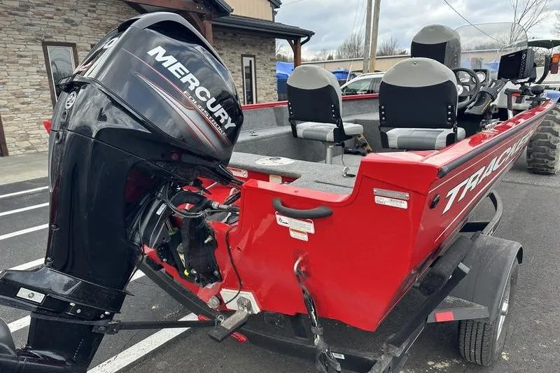 Slide: The Image of 2017 Tracker Pro Guide V-16 SC boat with Mercury outboard motor, parked on trailer. - 15
