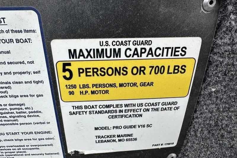 Slide: The Image of 2017 Tracker Pro Guide V-16 SC capacity label: 5 persons or 700 lbs, 90 HP motor. - 6