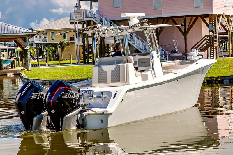 Slide: The Image of 2023 Front Runner 33 Center Console boat on calm water. - 1