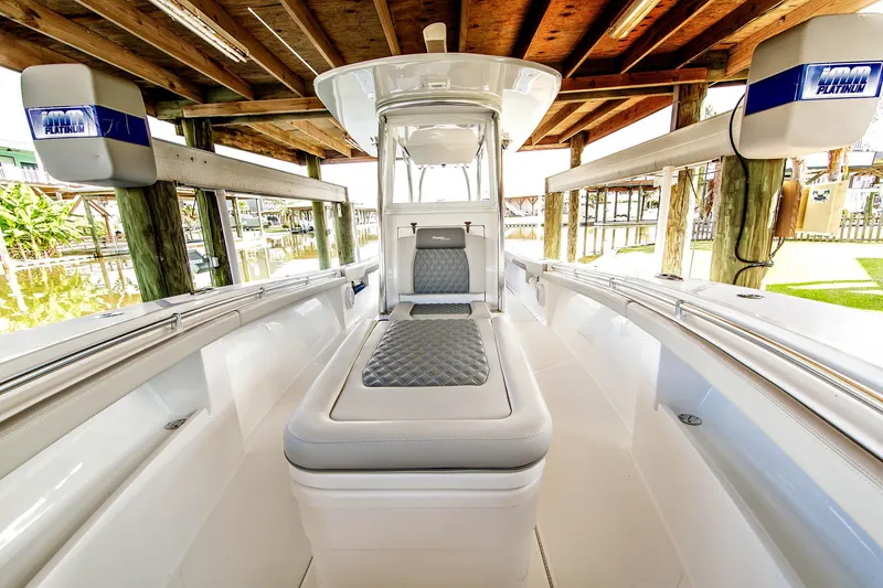 Slide: The Image of 2023 Front Runner 33 Center Console boat under wooden dock. - 10