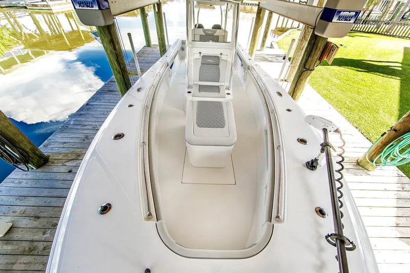 Slide: The Image of Front Runner 33 Center Console boat, 2023, docked on wooden pier. - 11