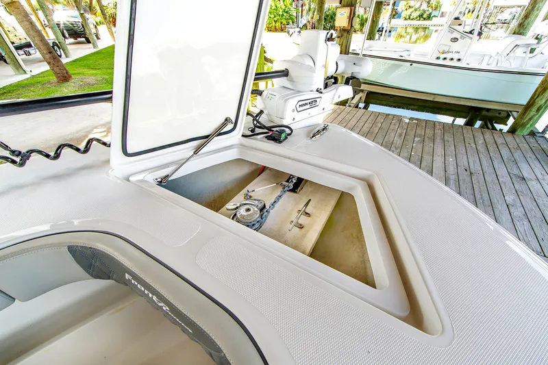 Slide: The Image of Front Runner 33 Center Console 2023 with open storage and Minn Kota motor. - 14