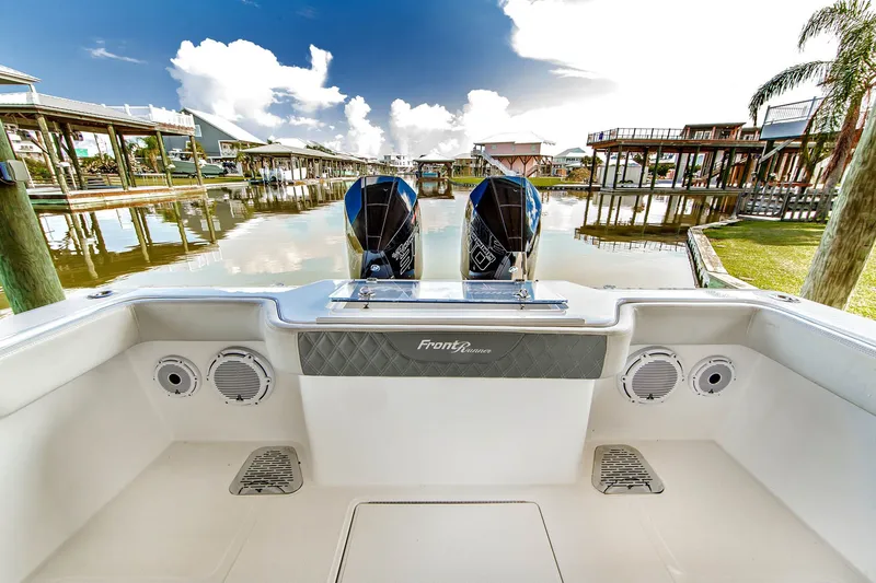 Slide: The Image of 2023 Front Runner 33 Center Console boat at dock with twin engines. - 19
