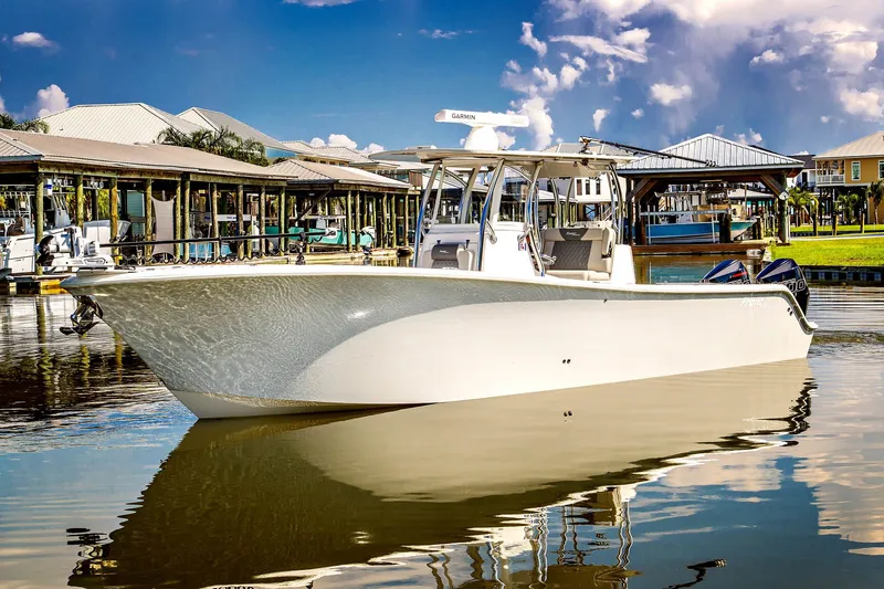 Slide: The Image of 2023 Front Runner 33 Center Console boat docked in harbor. - 2