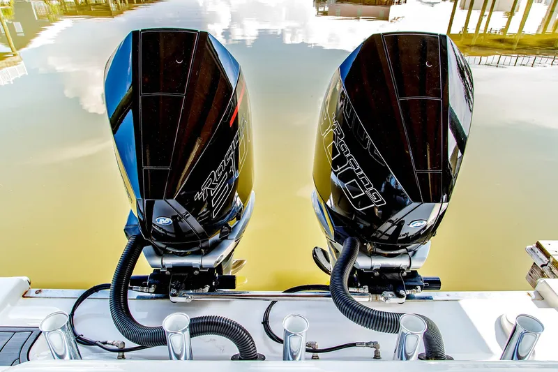 Slide: The Image of Two outboard engines on a 2023 Front Runner 33 Center Console boat. - 21