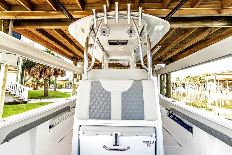 Slide: The Image of 2023 Front Runner 33 Center Console boat under wooden dock. - 8
