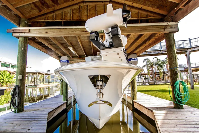 Slide: The Image of Front Runner 33 Center Console 2023 under a boathouse. - 9