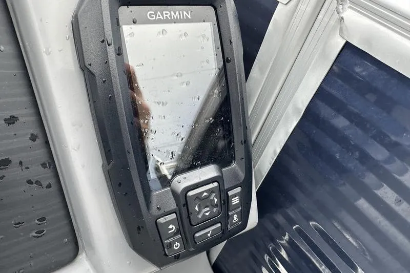 Slide: The Image of Garmin device on 2022 Bennington L 23 L-Bench, wet with raindrops. - 11