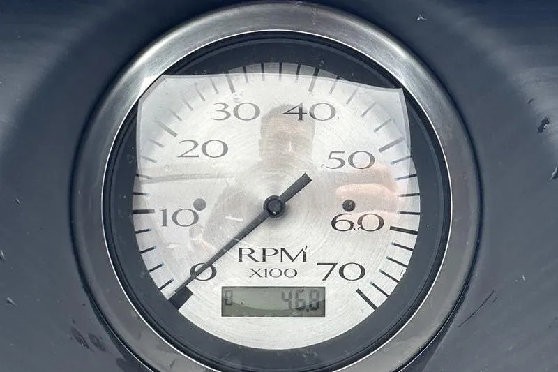 Slide: The Image of Close-up of a 2022 Bennington L 23 L-Bench RPM gauge showing 4600 RPM. - 16