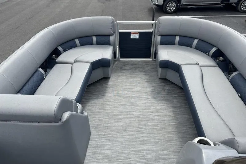 Slide: The Image of 2022 Bennington L 23 L-Bench pontoon boat with spacious seating and modern design. - 2