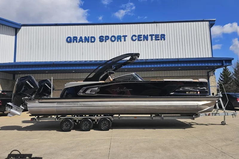 The Image of 2024 Avalon Excalibur Quad Lounge boat at Grand Sport Center, featuring sleek design and powerful engines. - 0