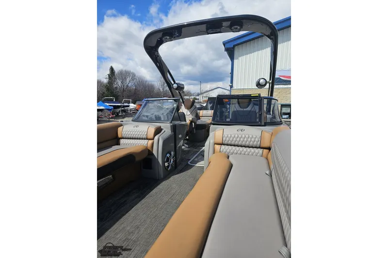 Slide: The Image of 2024 Avalon Excalibur Quad Lounge Windshield boat interior with luxurious seating. - 102