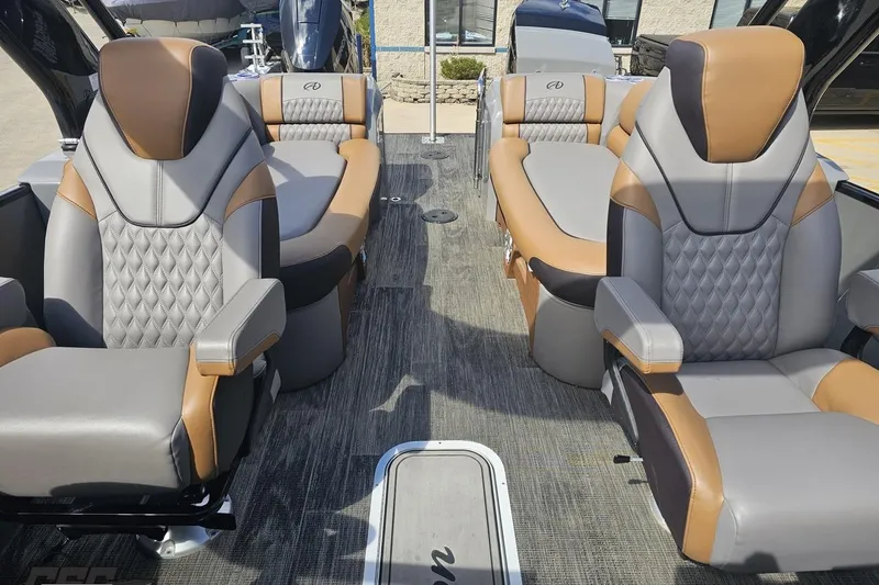 Slide: The Image of 2024 Avalon Excalibur Quad Lounge Windshield boat interior with luxurious seating. - 103