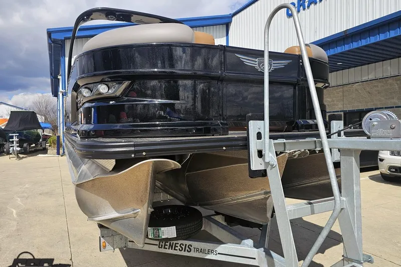 Slide: The Image of 2024 Avalon Excalibur Quad Lounge Windshield boat on Genesis trailer, parked outdoors. - 15