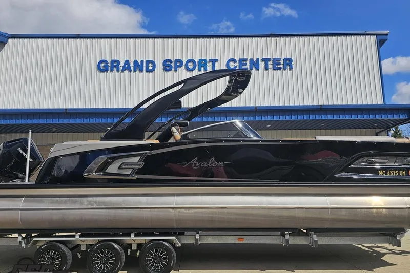 Slide: The Image of 2024 Avalon Excalibur Quad Lounge boat at Grand Sport Center, showcasing sleek design and luxury features. - 3