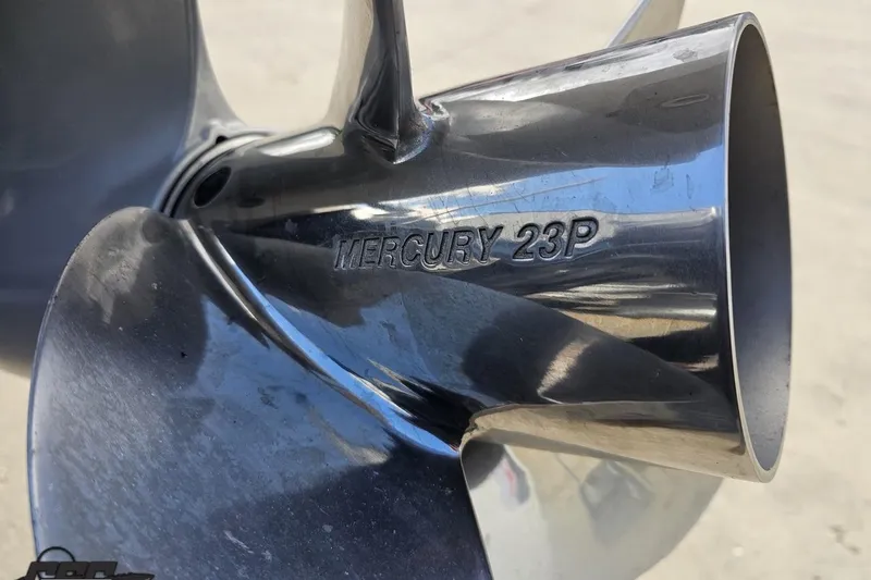 Slide: The Image of Close-up of a Mercury 23P propeller blade, reflecting light, for Avalon Excalibur 2024 boat. - 43
