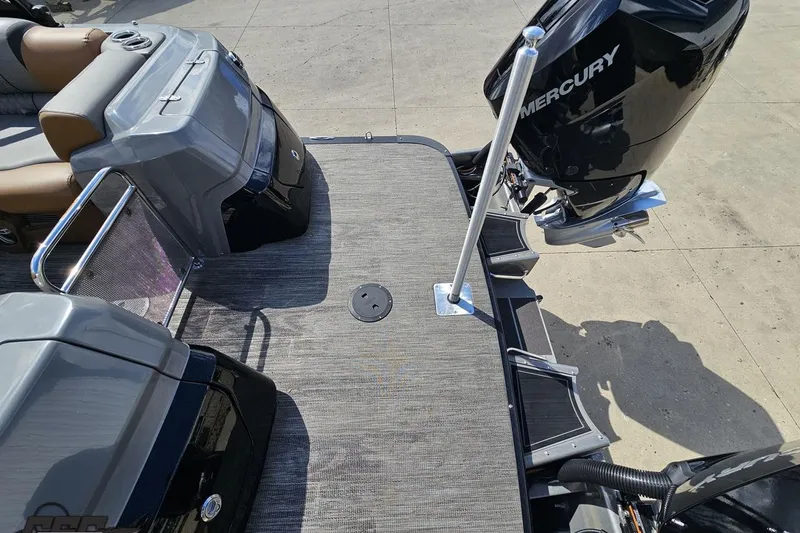 Slide: The Image of 2024 Avalon Excalibur Quad Lounge boat with Mercury engine, rear deck view. - 44