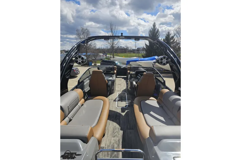 Slide: The Image of 2024 Avalon Excalibur Quad Lounge Windshield boat interior with plush seating and modern design. - 48